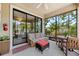 An open patio area with comfortable furniture, a ceiling fan and views of the outdoors at 3877 Burdick Loop, Odessa, FL 33556