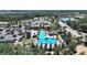 Aerial view of community featuring pools, clubhouse, and surrounding landscapes at 4063 Medicci Ln, Wesley Chapel, FL 33543
