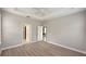Spacious bedroom with neutral walls, ceiling fan, vinyl plank flooring, and white doors at 4063 Medicci Ln, Wesley Chapel, FL 33543