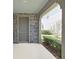 Covered front porch with stone accents, offering a welcoming entry to the home at 4063 Medicci Ln, Wesley Chapel, FL 33543