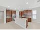 Well-appointed kitchen with a center island, stainless steel appliances, and abundant storage at 4063 Medicci Ln, Wesley Chapel, FL 33543