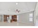Spacious kitchen featuring stainless steel appliances, brown wood cabinetry and a kitchen island at 4063 Medicci Ln, Wesley Chapel, FL 33543