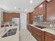 Beautiful kitchen featuring a center island, stainless steel appliances, and modern design at 4063 Medicci Ln, Wesley Chapel, FL 33543
