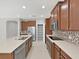Modern kitchen featuring a center island, stainless steel appliances, and ample counter space at 4063 Medicci Ln, Wesley Chapel, FL 33543