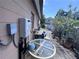 Side backyard with a water heater installed and patio furniture at 4104 W North B St, Tampa, FL 33609