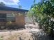 The backyard of this charming home features drought resistant plants, a brick border and a white privacy fence at 4104 W North B St, Tampa, FL 33609