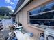 Exterior shot of the home with a view of the windows, back door, and yard area at 4104 W North B St, Tampa, FL 33609