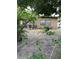 A framed view of a house with a teal door and brown trim at 4104 W North B St, Tampa, FL 33609