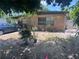 This home's front yard is landscaped with drought-resistant plants and a small brick border, perfect for low-maintenance living at 4104 W North B St, Tampa, FL 33609