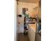 Laundry area with stacked washer and dryer and storage shelving at 4104 W North B St, Tampa, FL 33609