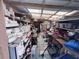 View of a cluttered storage space filled with shelves and various items, typical of a utility or work area at 4104 W North B St, Tampa, FL 33609