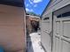 View of side and backyard area, showing the compact space between buildings and storage sheds at 4104 W North B St, Tampa, FL 33609