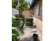 Exterior shot of air conditioning unit in the yard with plants and a small fence at 4104 W North B St, Tampa, FL 33609
