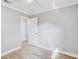 Light bedroom with wood floors, and attached bathroom at 416 Flamingo Dr, Apollo Beach, FL 33572