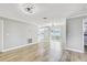Bright, open living area with wood floors and sliding glass doors leading to backyard at 416 Flamingo Dr, Apollo Beach, FL 33572