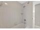 Bright bathroom featuring a tiled shower-tub combination with updated fixtures at 4512 24Th Ave S, Tampa, FL 33619