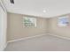 Cozy bedroom with tile flooring and natural light streaming through the windows at 4512 24Th Ave S, Tampa, FL 33619
