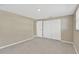 Simple bedroom features tile flooring, neutral paint, and ample closet space at 4512 24Th Ave S, Tampa, FL 33619