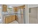 Well-lit kitchen featuring stainless steel appliances and wooden cabinetry at 4512 24Th Ave S, Tampa, FL 33619