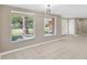 Bright living room with large windows and neutral tile floors at 4512 24Th Ave S, Tampa, FL 33619