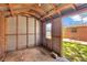 Shed interior with plank walls and exposed rafters, with a window at 4512 24Th Ave S, Tampa, FL 33619