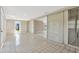 Enclosed sunroom with tile flooring, sliding glass doors, and access to the backyard at 4512 24Th Ave S, Tampa, FL 33619