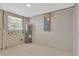 Well-lit utility room with window, painted floor, and updated water heater at 4512 24Th Ave S, Tampa, FL 33619