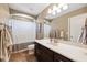 Full bathroom features a shower/tub combo and single vanity at 4717 W Lawn Ave, Tampa, FL 33611