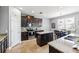 Beautiful kitchen with granite countertops, stainless steel appliances, dark cabinetry, and a cozy breakfast nook at 4717 W Lawn Ave, Tampa, FL 33611