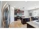 Gourmet kitchen boasts granite countertops, stainless steel appliances, dark cabinetry, and a cozy breakfast nook at 4717 W Lawn Ave, Tampa, FL 33611
