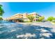 Condo complex with covered parking, mature trees, and well-maintained landscaping on a bright day at 4885 1St Ne St # 110, St Petersburg, FL 33703