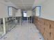 Unfinished interior space with drop ceiling, exposed walls and covered cabinets at 4885 1St Ne St # 110, St Petersburg, FL 33703