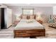Relaxing bedroom with rustic wood accents and wood laminate flooring at 5153 Miller Bayou Dr, Port Richey, FL 34668