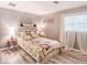 Bright bedroom featuring wood floors, and an accent wall at 5153 Miller Bayou Dr, Port Richey, FL 34668