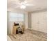 Bright bedroom featuring a ceiling fan and wood laminate flooring at 5153 Miller Bayou Dr, Port Richey, FL 34668
