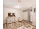 Spacious bedroom with light wood-look flooring and neutral tones at 5153 Miller Bayou Dr, Port Richey, FL 34668