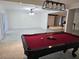 Spacious game room with a classic pool table and ample room for entertainment at 5153 Miller Bayou Dr, Port Richey, FL 34668
