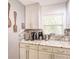 Well-lit kitchen features granite countertops, white cabinets, and stainless steel appliances at 5153 Miller Bayou Dr, Port Richey, FL 34668