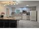 Well-lit, modern kitchen with granite countertops and modern appliances provides a functional and inviting space at 5153 Miller Bayou Dr, Port Richey, FL 34668