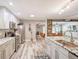 Well-lit kitchen features granite countertops, stainless steel appliances, and opens to living room at 5153 Miller Bayou Dr, Port Richey, FL 34668