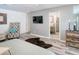 Large primary bedroom featuring a TV and ensuite bathroom at 5153 Miller Bayou Dr, Port Richey, FL 34668