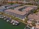 Aerial view of waterfront community with canal, boat docks, and easy access to multi-story townhome at 521 Pinellas Bayway S # 301, St Petersburg, FL 33715