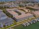 Aerial view of waterfront condo community, showcasing beautiful landscaping and boat docks on the canal at 521 Pinellas Bayway S # 301, St Petersburg, FL 33715