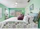 Bright and airy bedroom with a ceiling fan, large windows, and coastal decor at 521 Pinellas Bayway S # 301, St Petersburg, FL 33715