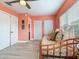 Bright bedroom with a twin bed and doors to closets and to the ensuite bath at 521 Pinellas Bayway S # 301, St Petersburg, FL 33715