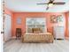 Bright bedroom with a ceiling fan, a twin bed, and white cabinets at 521 Pinellas Bayway S # 301, St Petersburg, FL 33715