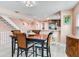 Bright dining area features an elegant table set and opens into the living room and kitchen at 521 Pinellas Bayway S # 301, St Petersburg, FL 33715