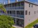 Three-story condominium building featuring screened lanais at 521 Pinellas Bayway S # 301, St Petersburg, FL 33715