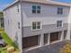 Modern townhome exterior featuring attached garages and neutral color scheme at 521 Pinellas Bayway S # 301, St Petersburg, FL 33715