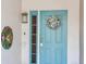 Charming front door with coastal-themed wreath, creating a welcoming entrance at 521 Pinellas Bayway S # 301, St Petersburg, FL 33715